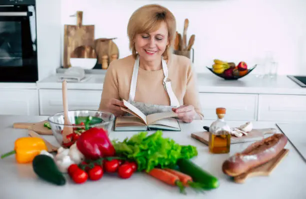 Woman looking at a cookbook